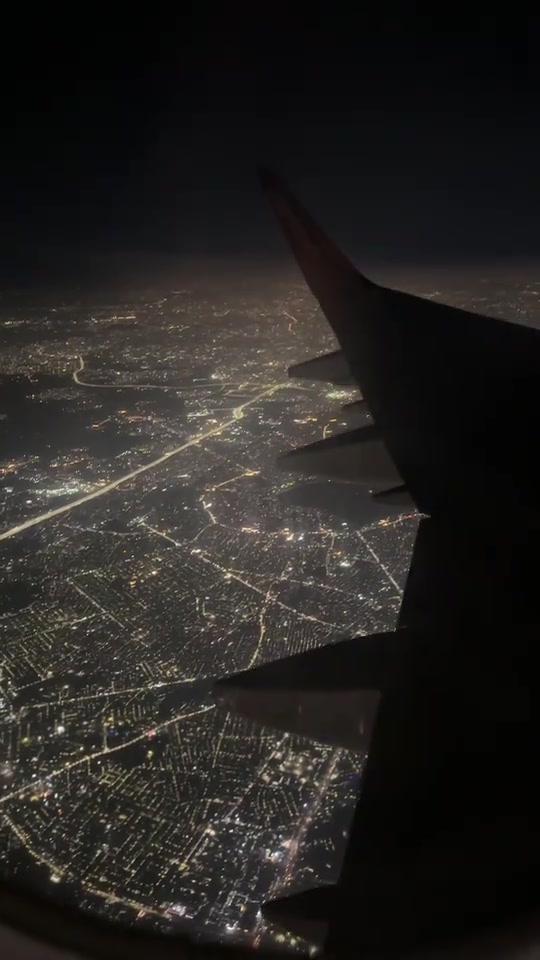 Night Flight Over City