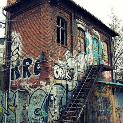 Graffiti-covered brick building