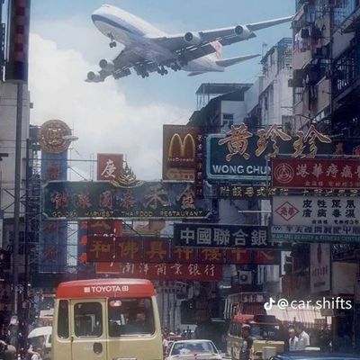Airplane Over Busy Street
