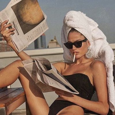 Woman Reading Newspaper Post-Spa