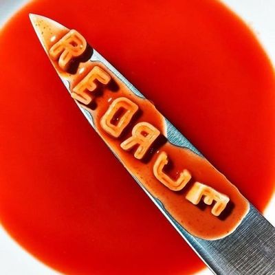 Cum-covered knife in red sauce