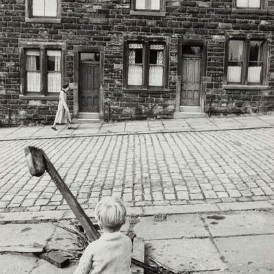 Child Watching Woman Walk Past