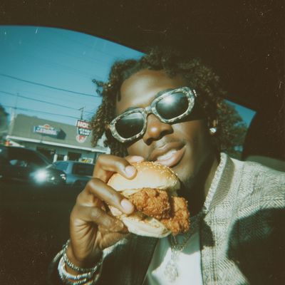 Man Eating Burger in Car