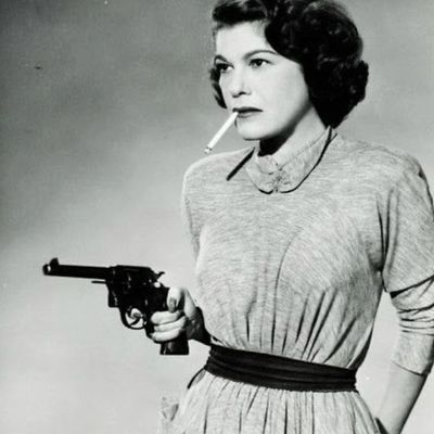 Vintage woman with gun and cigarette