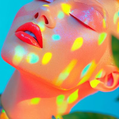 Colorful Light Projection on Woman's Face