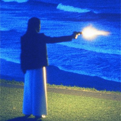 Silhouette of Person Pointing at Ocean