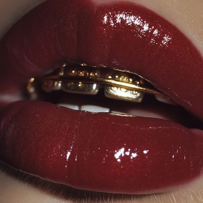 Glossy Red Lips with Gold Teeth