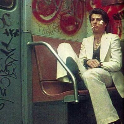 Man Smoking on Graffiti Subway