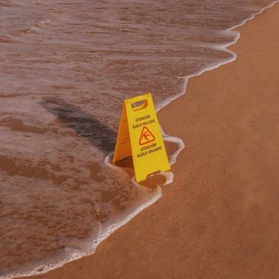 Slippery Beach Warning Sign
