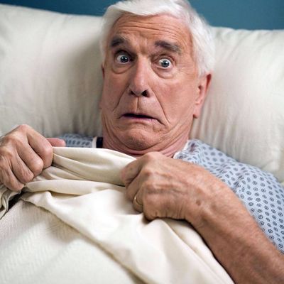 elderly man in hospital bed