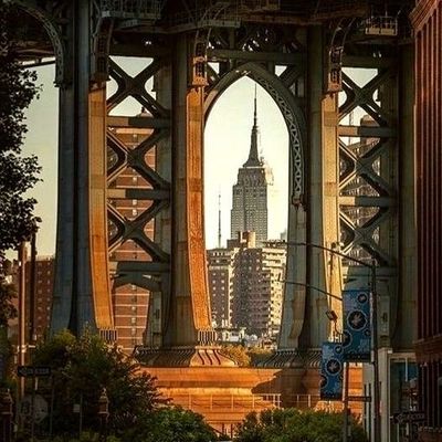 Empire State Building framed by bridge