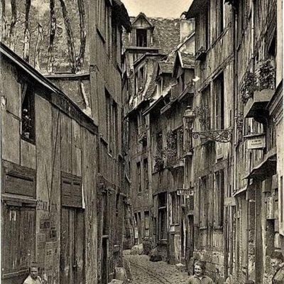 Narrow cobblestone alley with old timbered houses