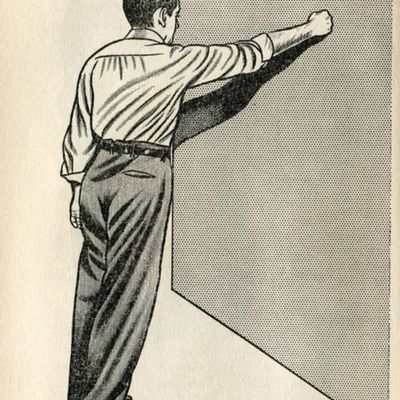 Man in Formalwear Punching Wall