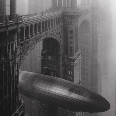Steampunk dirigible over Victorian architecture