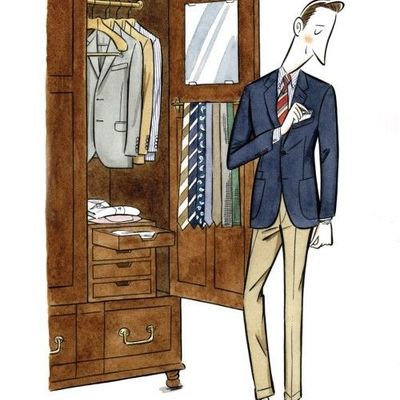 Man Choosing Suit from Wardrobe