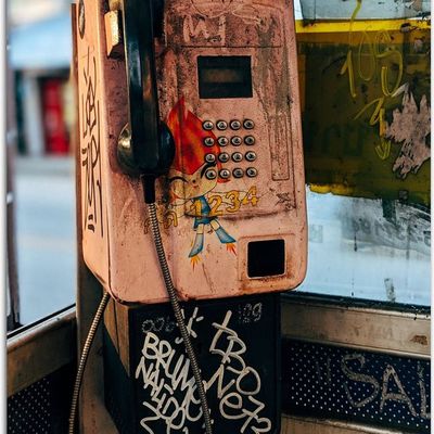 Graffiti-covered payphone