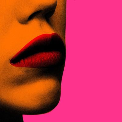 Close-up of lips against vibrant background