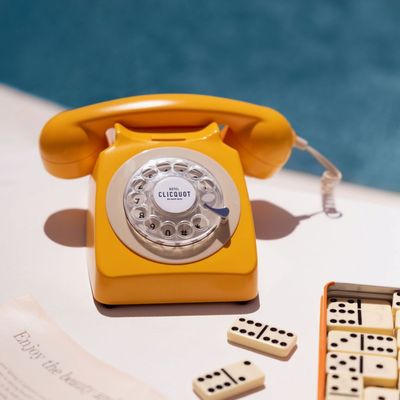 Vintage Yellow Telephone with Dominoes