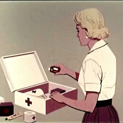 Woman Organizing First Aid Kit