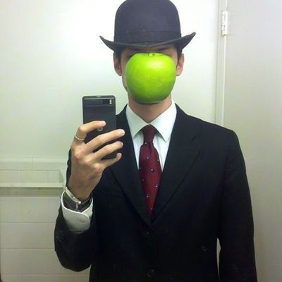 Man in Suit with Apple Mask