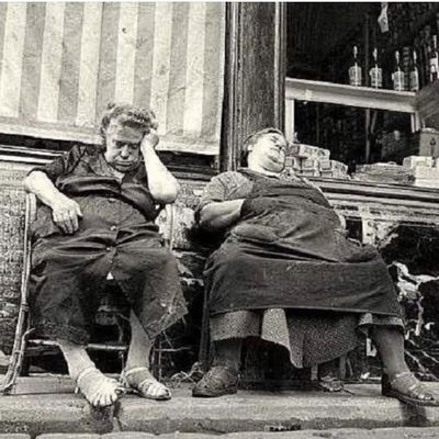 Two Women Sleeping on Steps