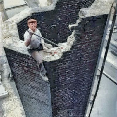 Man Painting Brick Wall