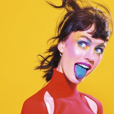 Vividly Painted Woman Tongue-Out