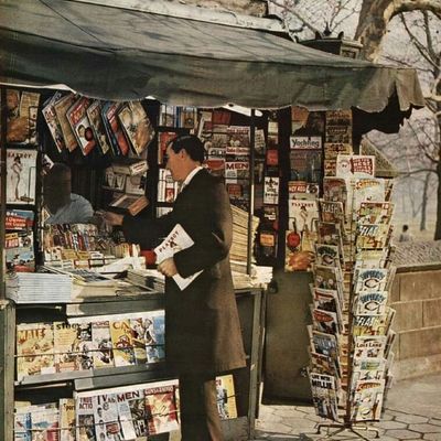Man browsing magazines at a newsstand