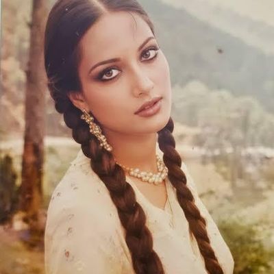 Elegant Braided Hair in Nature braids pearl earrings nature mountains trees