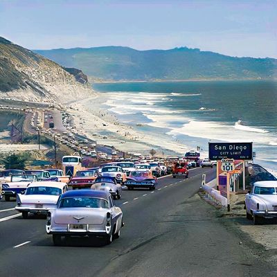 Vintage Traffic Jam by the Coast vintage traffic jam coastal highway classic cars ocean waves