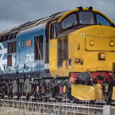 Yellow Locomotive on Tracks