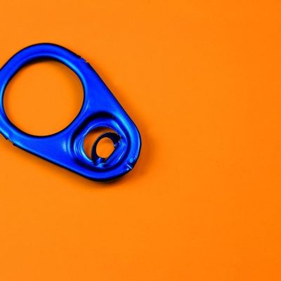 Blue Metal Ring on Orange Background metal ring spring mechanism orange