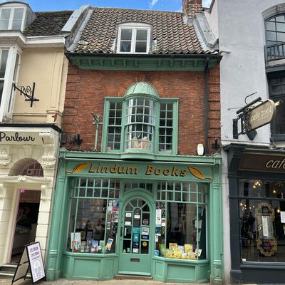 Lindum Books Shopfront bookstore shopfront brick building green facade historic town