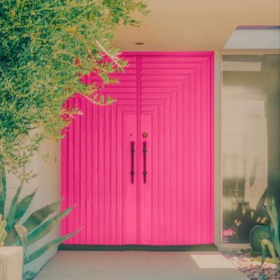 Bright Pink Doors Amid Greenery