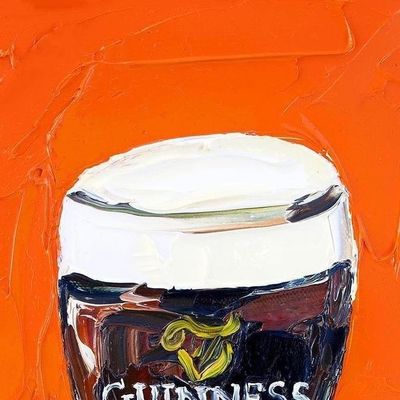Guinness pint on vibrant orange