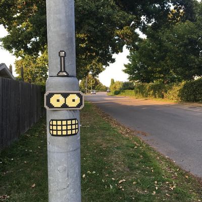 Pixelated Eyes on Pole