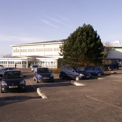 Severn Bridge Services, 1990s school parking lot cars trees buildings