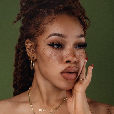 Curly Haired Woman with Freckles