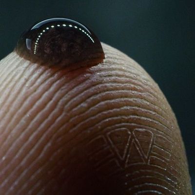 Close-Up of a Thumb with a Water Drop