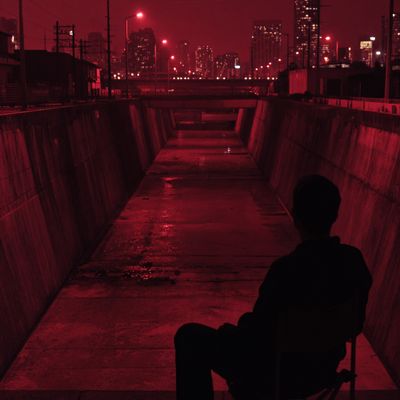 Red-lit urban solitude