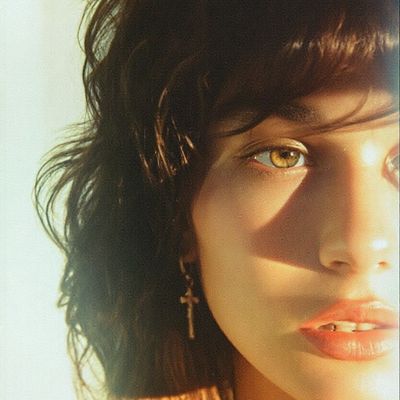 Close-Up of Woman with Cross Earrings